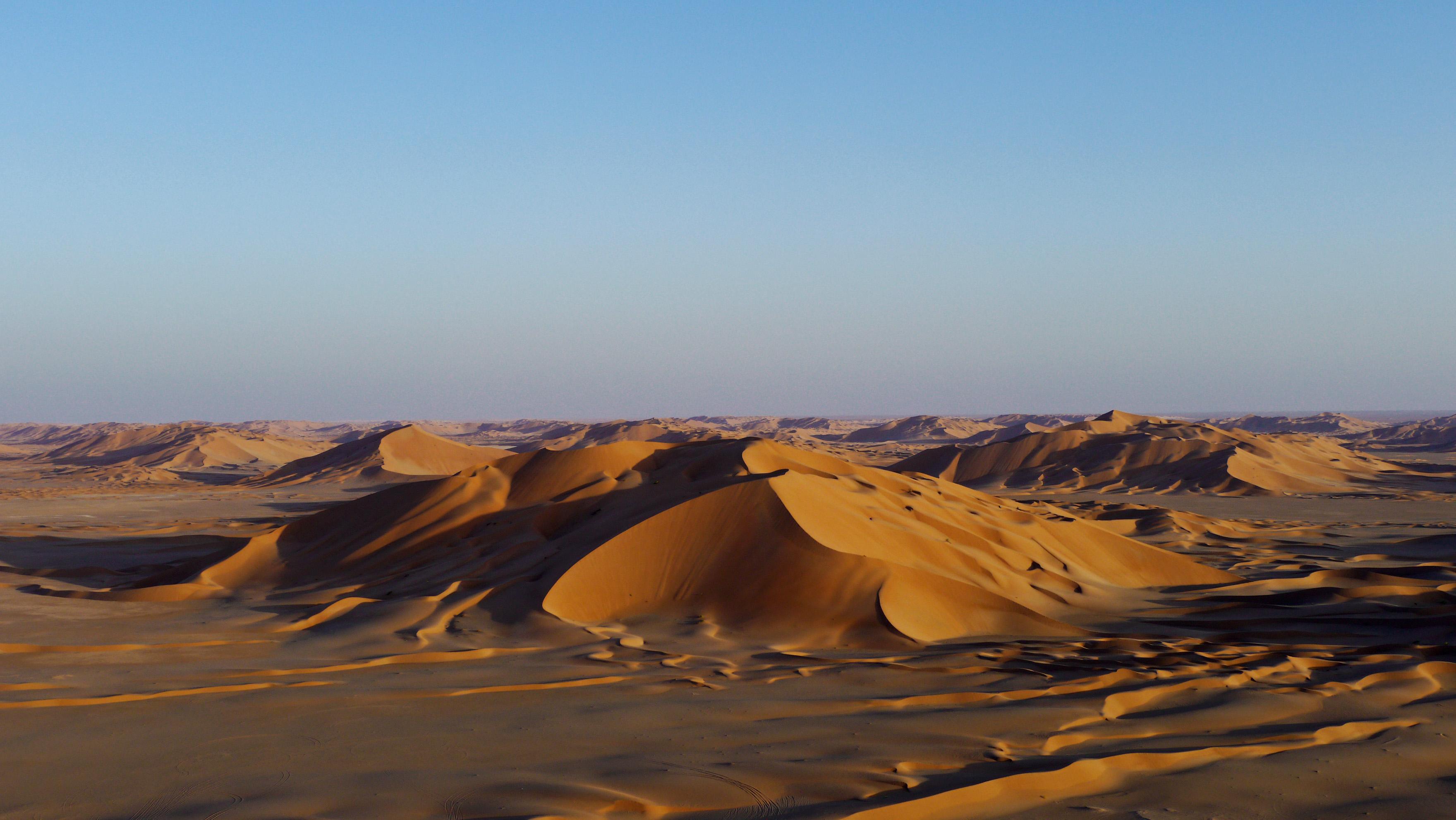 Sunset on the dunes in the Empty Quarter, trip to the desert from Salalah with Takamul Travel.