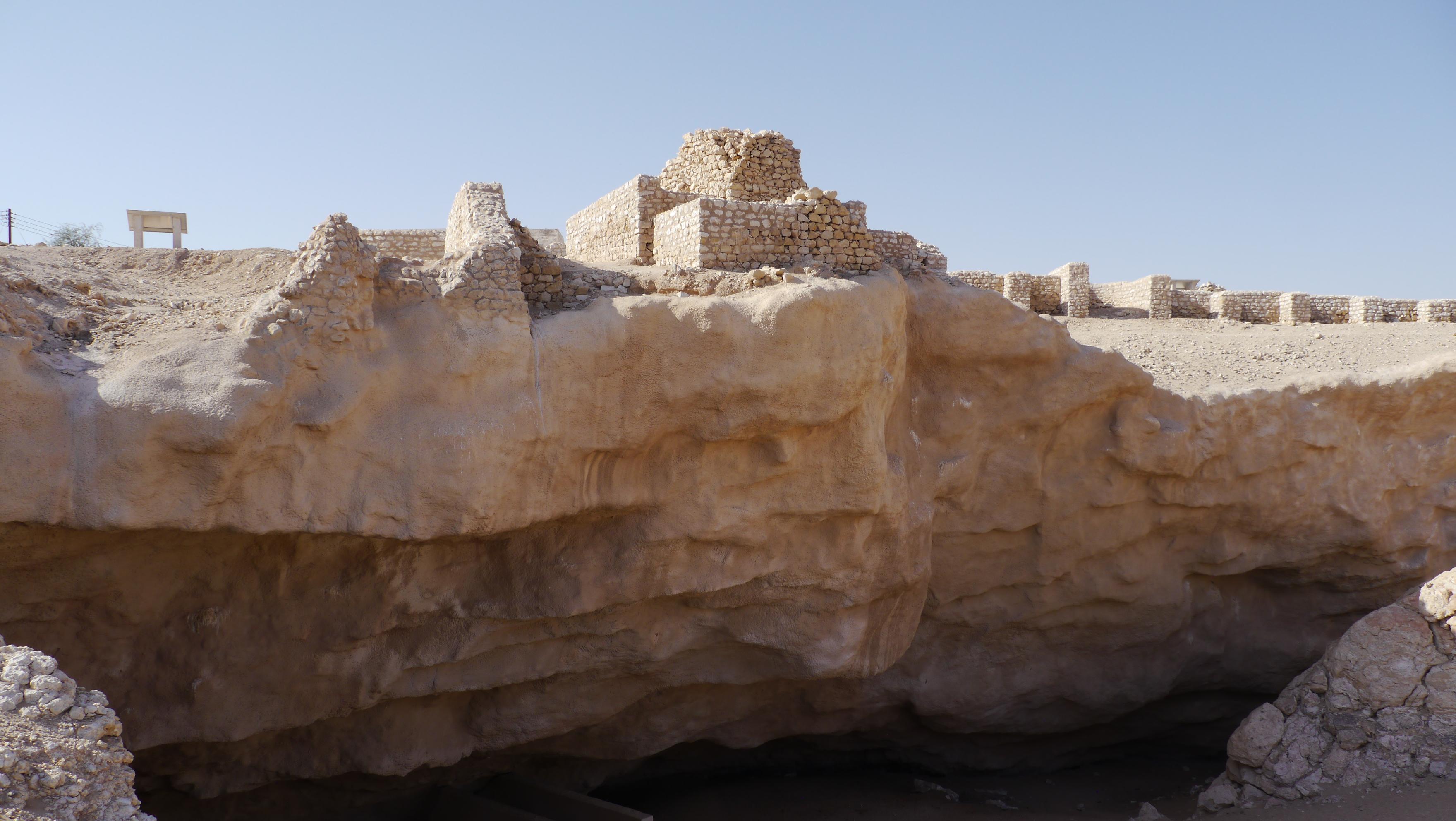 The ruins of medieval commercial center Ubar lie on the route to the Empty Quarter Desert. Frankincense trade stop. Sunset in the desert tour from Salalah.