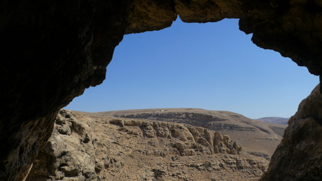 Mountain view from a cave in Dhofar Mountains. Day with camel herdsmen. Salalah trip.