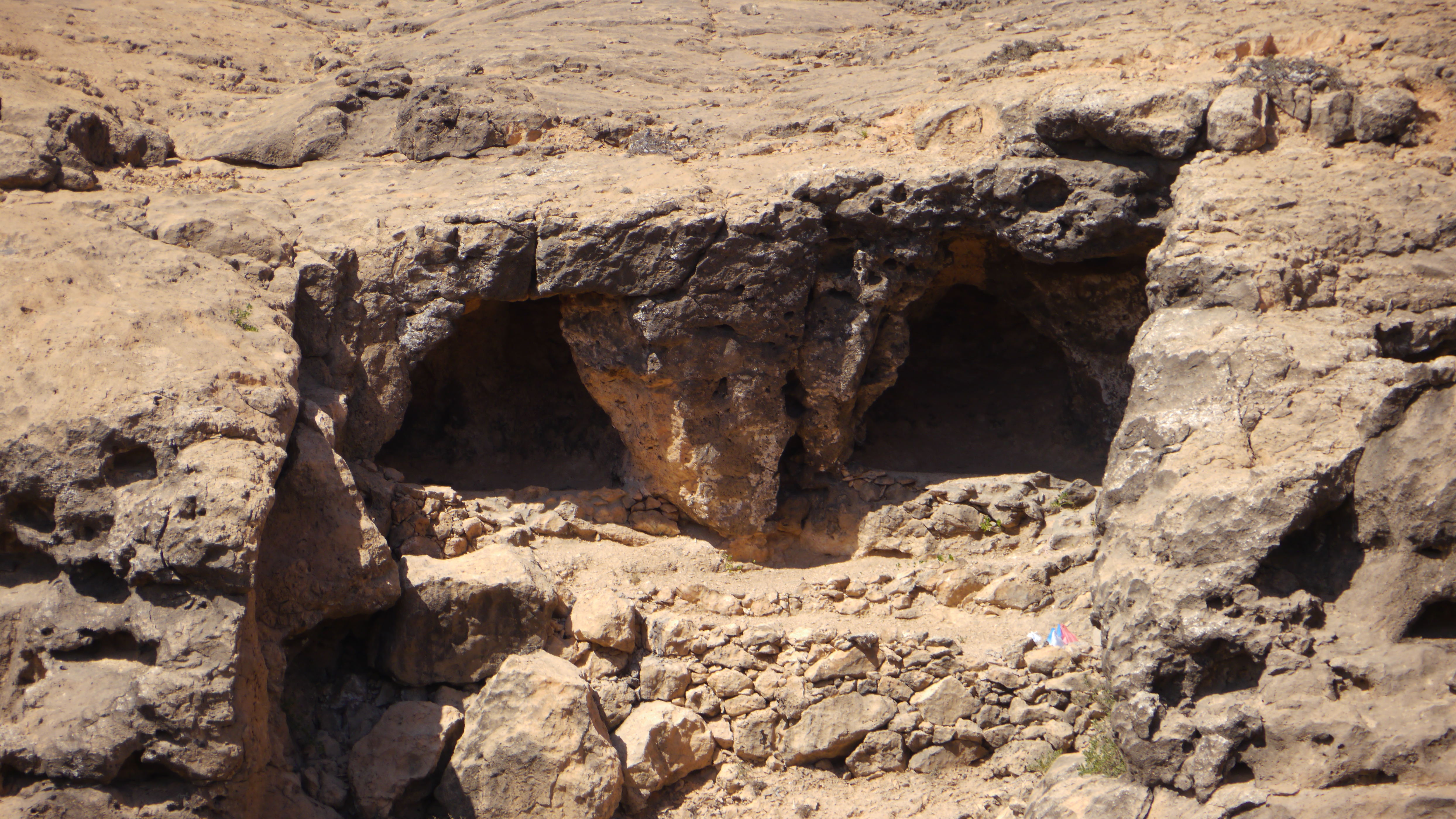 Mountain view from a cave in Dhofar Mountains. Day with camel herdsmen. Salalah trip.